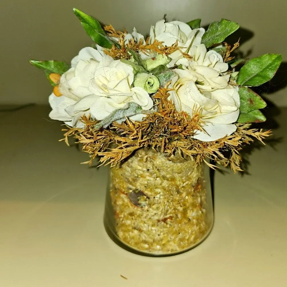 Floral Arrangement with White Roses and Leaves in Glass Vase
